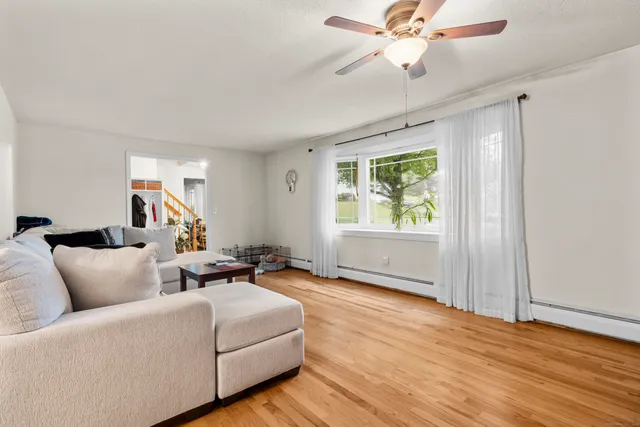 a living room with furniture and a window