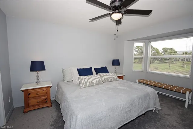 a bedroom with bed and a night stand