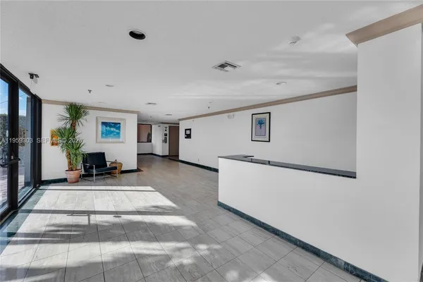 a view of a livingroom with furniture and window