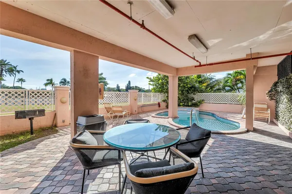 a outdoor dining space with furniture and outdoor view