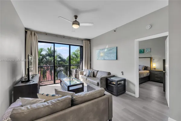 a living room with furniture and a large window