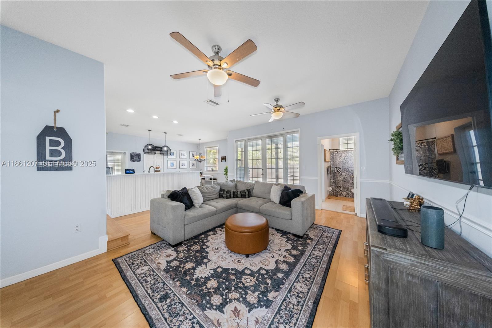 9822 Southwest 161st Place Miami, FL 33196 - Photo 15 of 47 a living room with furniture a rug and a window