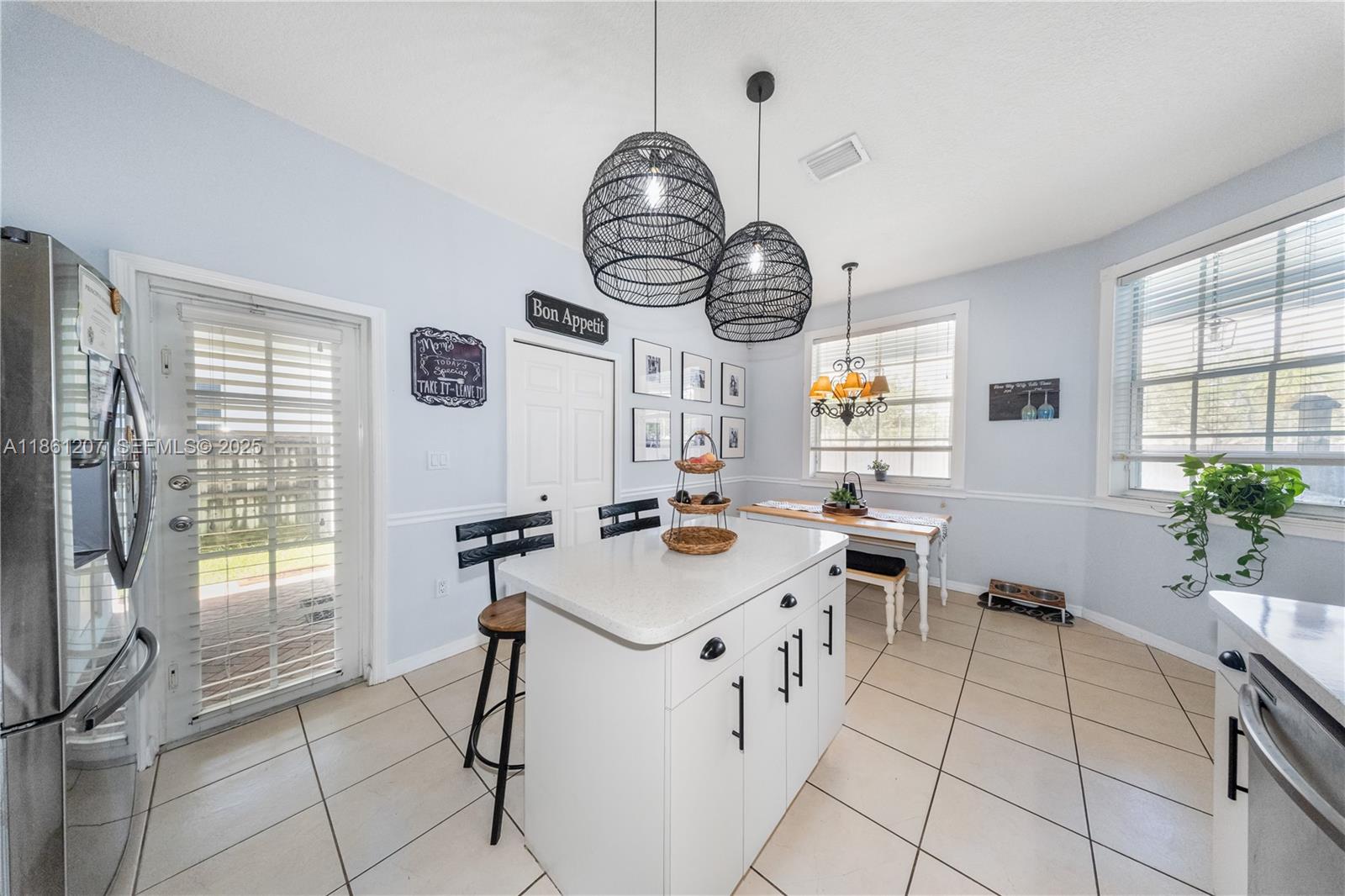 9822 Southwest 161st Place Miami, FL 33196 - Photo 20 of 47 a room with furniture a window and a clock