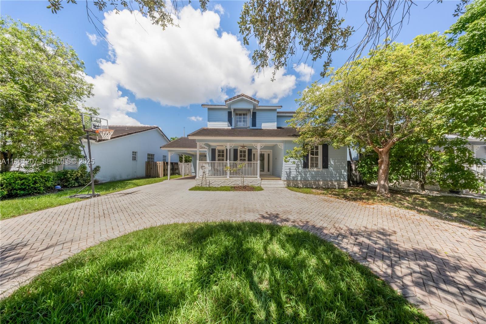 9822 Southwest 161st Place Miami, FL 33196 - Photo 2 of 47 a front view of a house with a garden