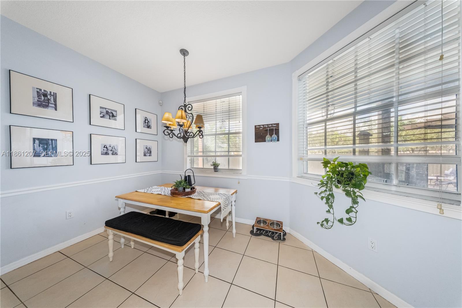 9822 Southwest 161st Place Miami, FL 33196 - Photo 21 of 47 a living room with furniture and a potted plant