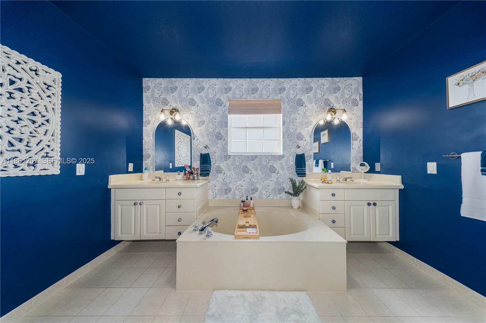 9822 Southwest 161st Place Miami, FL 33196 - Photo 29 of 47 a bathroom with a bathtub sink mirror and toilet