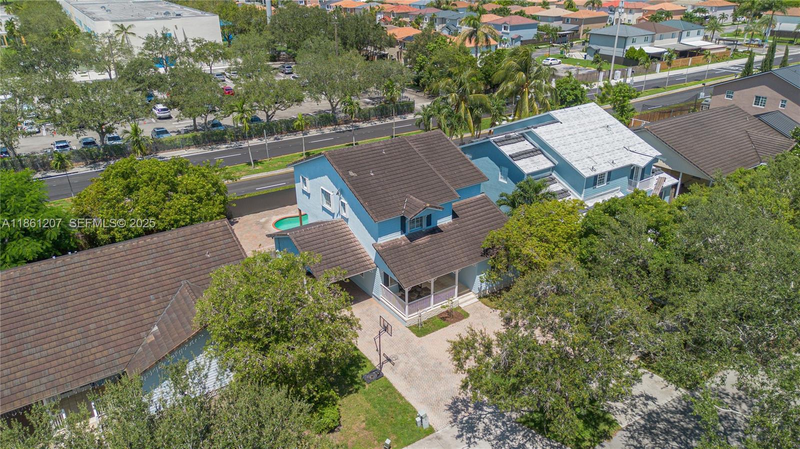 9822 Southwest 161st Place Miami, FL 33196 - Photo 3 of 47 an aerial view of residential house with outdoor space and trees all around