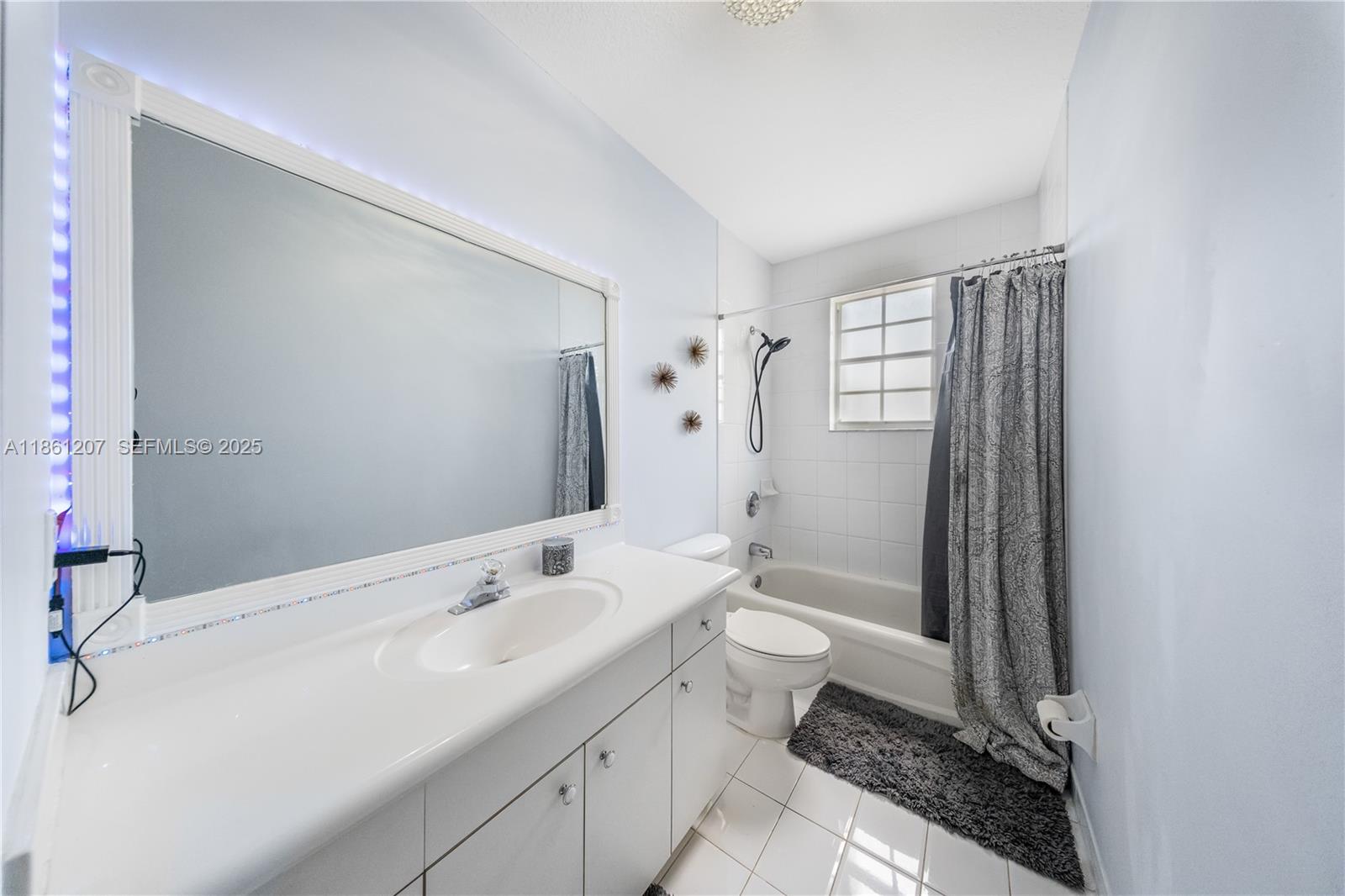 9822 Southwest 161st Place Miami, FL 33196 - Photo 33 of 47 a bathroom with a granite countertop sink toilet and shower