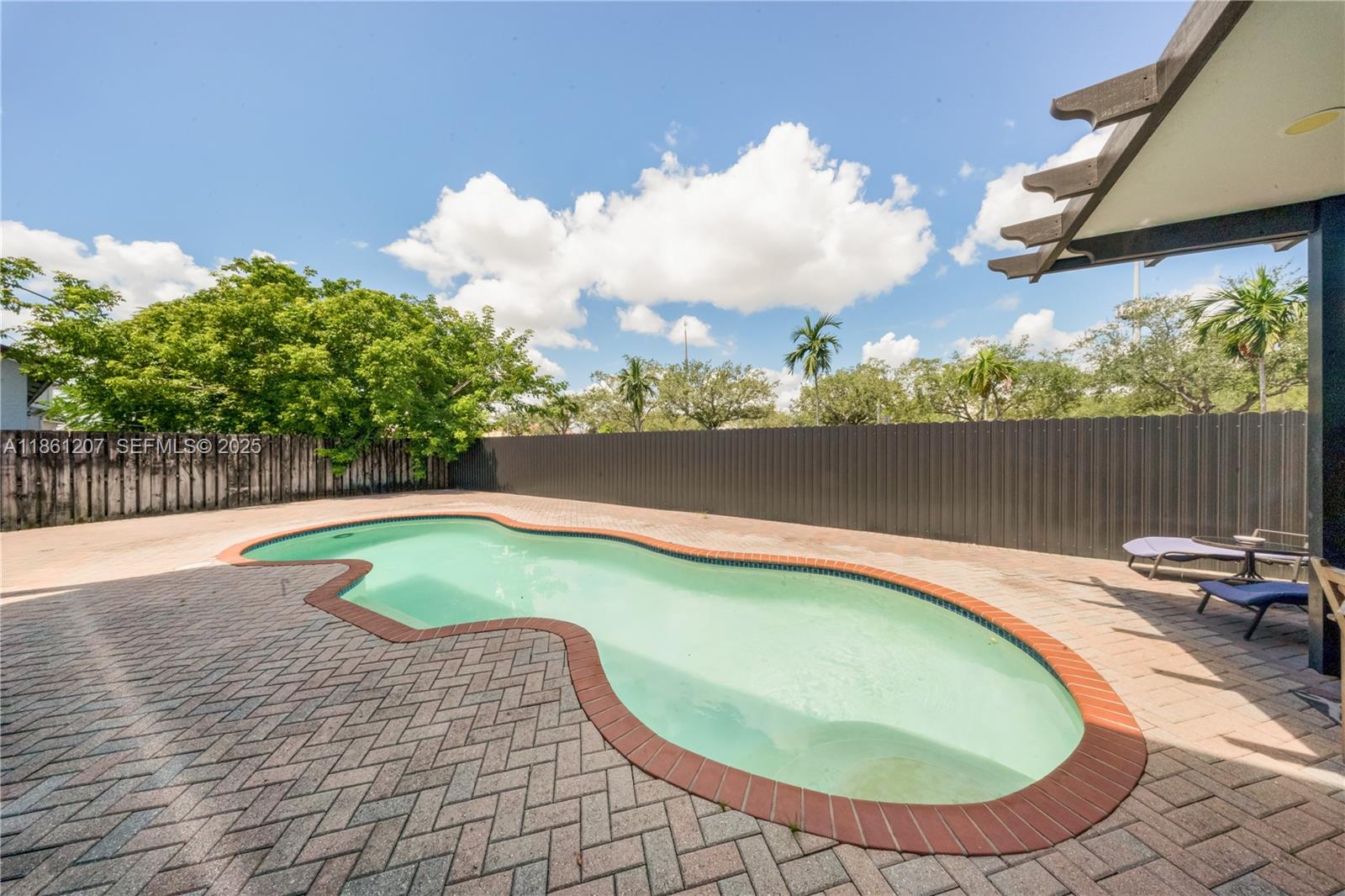 9822 Southwest 161st Place Miami, FL 33196 - Photo 39 of 47 a view of swimming pool with seating space