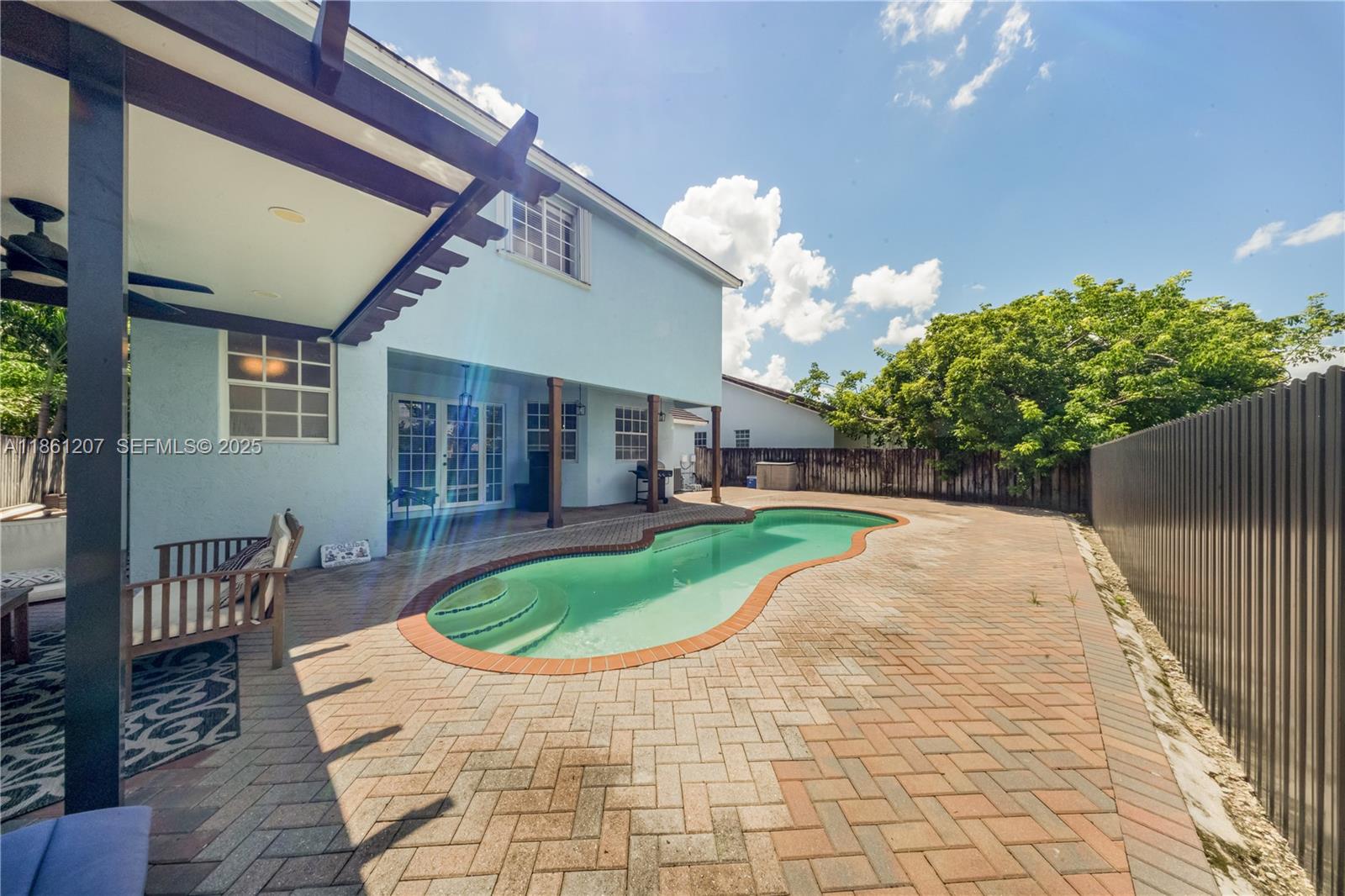 9822 Southwest 161st Place Miami, FL 33196 - Photo 41 of 47 a house view with a seating space