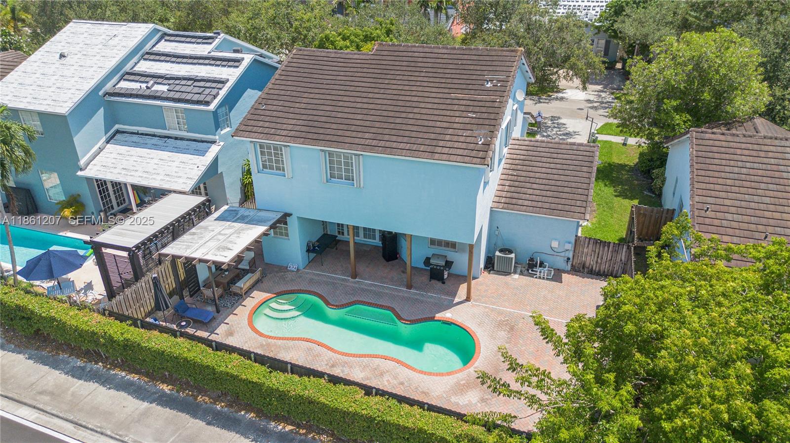 9822 Southwest 161st Place Miami, FL 33196 - Photo 42 of 47 an aerial view of a house with swimming pool and patio