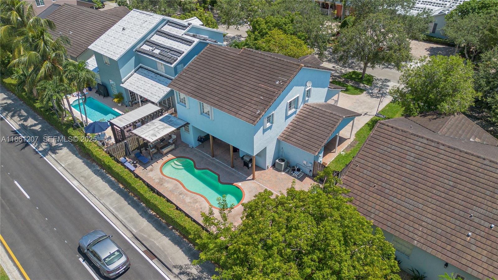 9822 Southwest 161st Place Miami, FL 33196 - Photo 44 of 47 a aerial view of a house with a yard