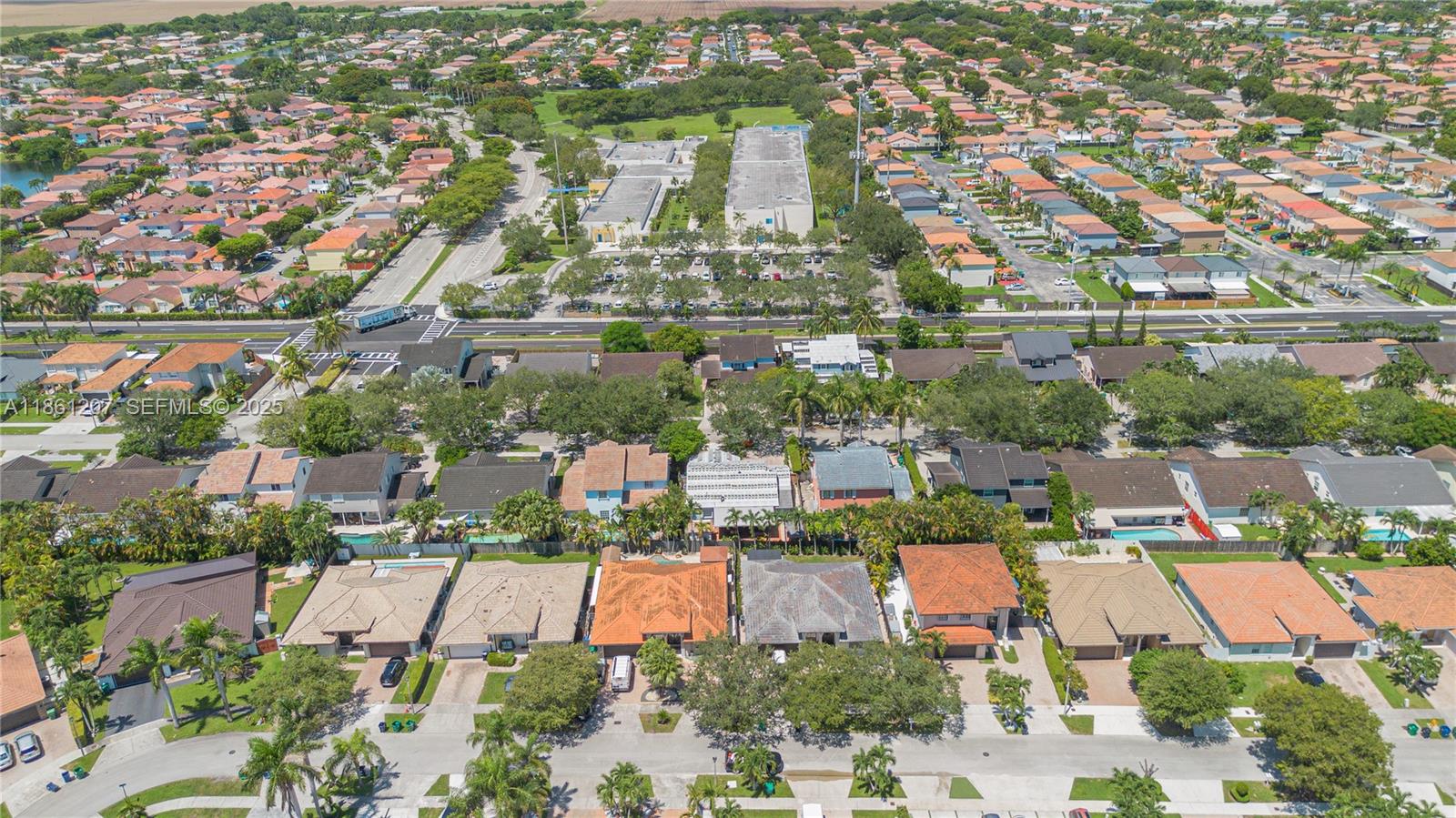 9822 Southwest 161st Place Miami, FL 33196 - Photo 46 of 47 an aerial view of residential building and lake