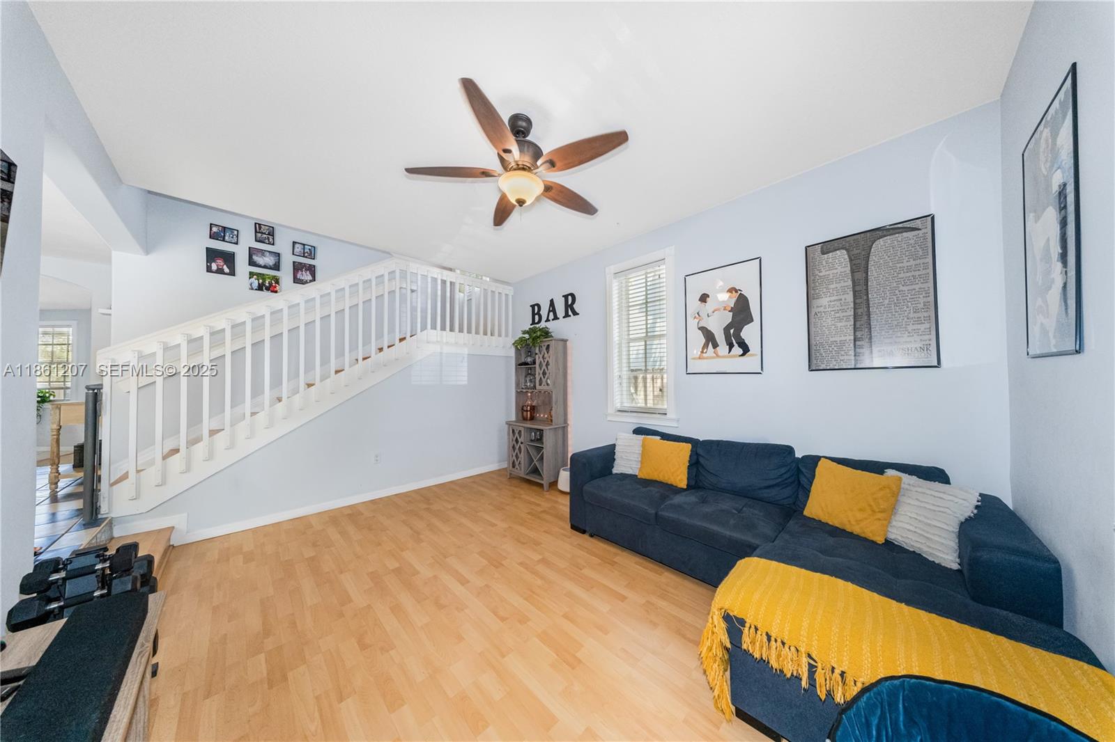 9822 Southwest 161st Place Miami, FL 33196 - Photo 9 of 47 a workspace with wooden floor and furniture