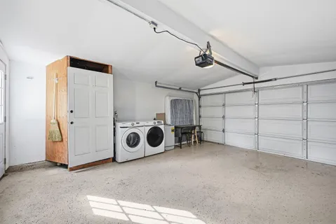 a view of a garage with washing machine
