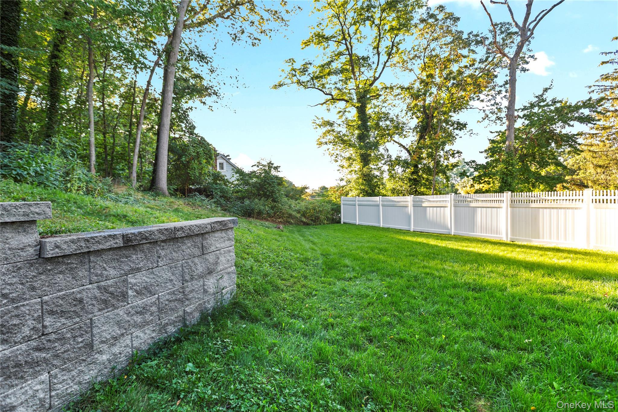24 Belmont Road Sound Beach, NY 11789 - Photo 23 of 23 a view of a backyard with green space