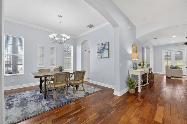a view of a dining room with furniture and wooden floor
