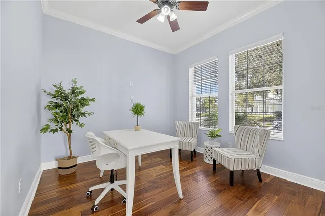 a view of an entryway with wooden floor and a livingroom