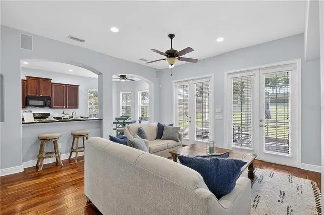 a kitchen with granite countertop a stove sink and cabinets