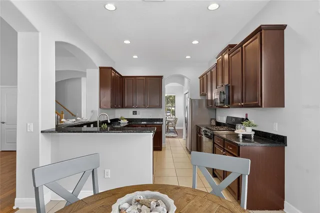 a bathroom with a sink a light fixture and a mirror