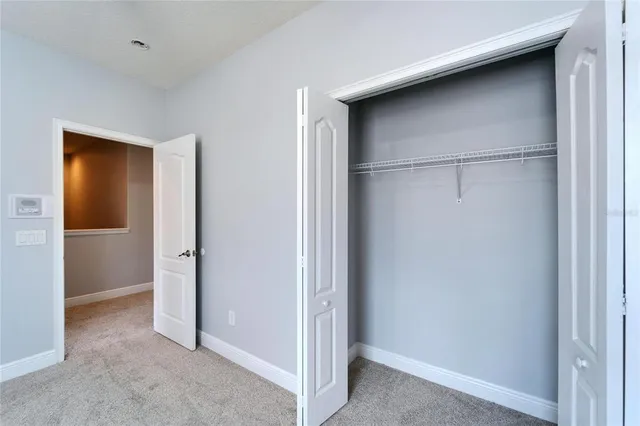 an aerial view of a house with swimming pool outdoor seating and yard