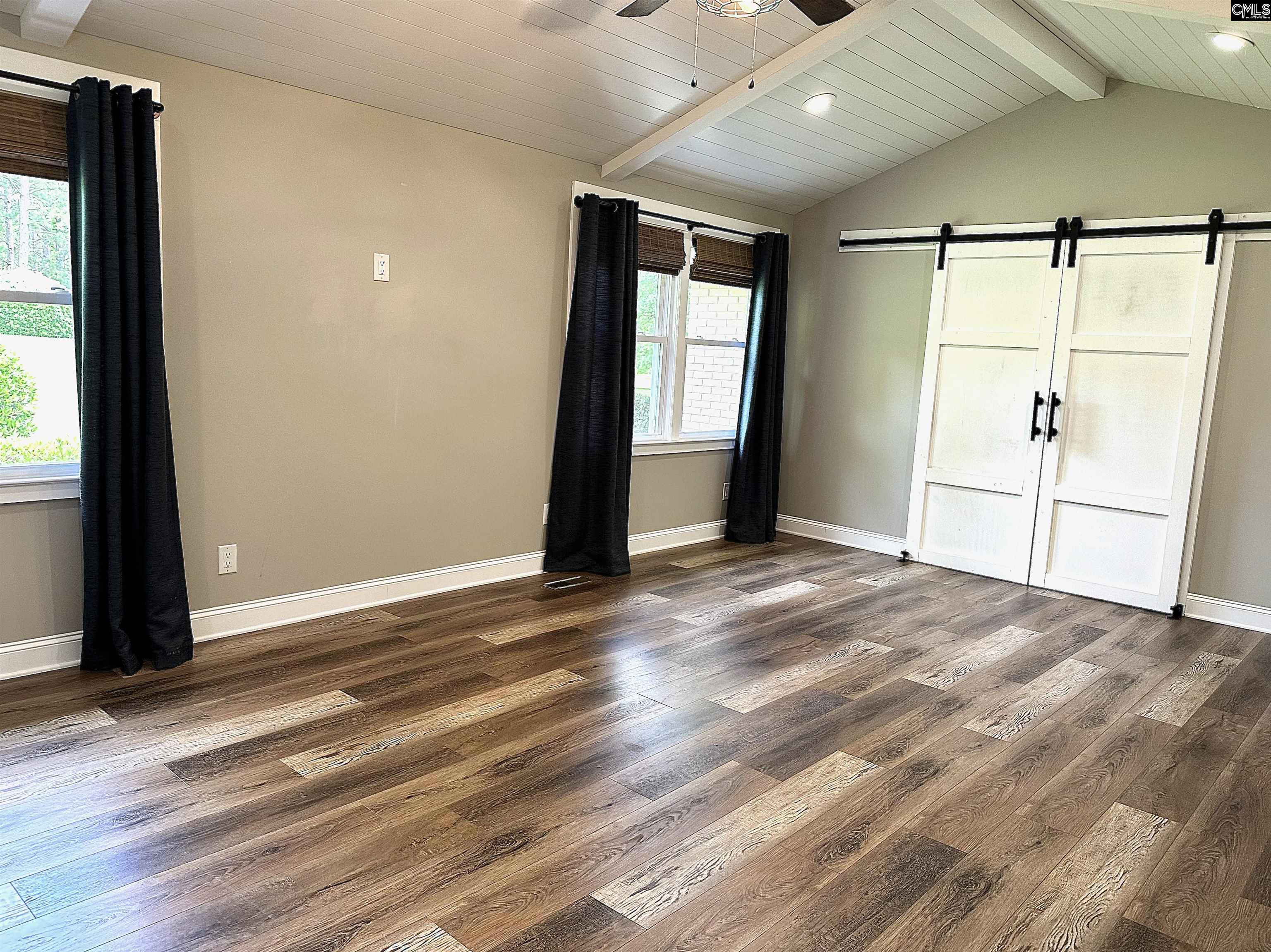 535 Sandbar Road Chapin, SC 29036 - Photo 16 of 23 a view of empty room with wooden floor and fan