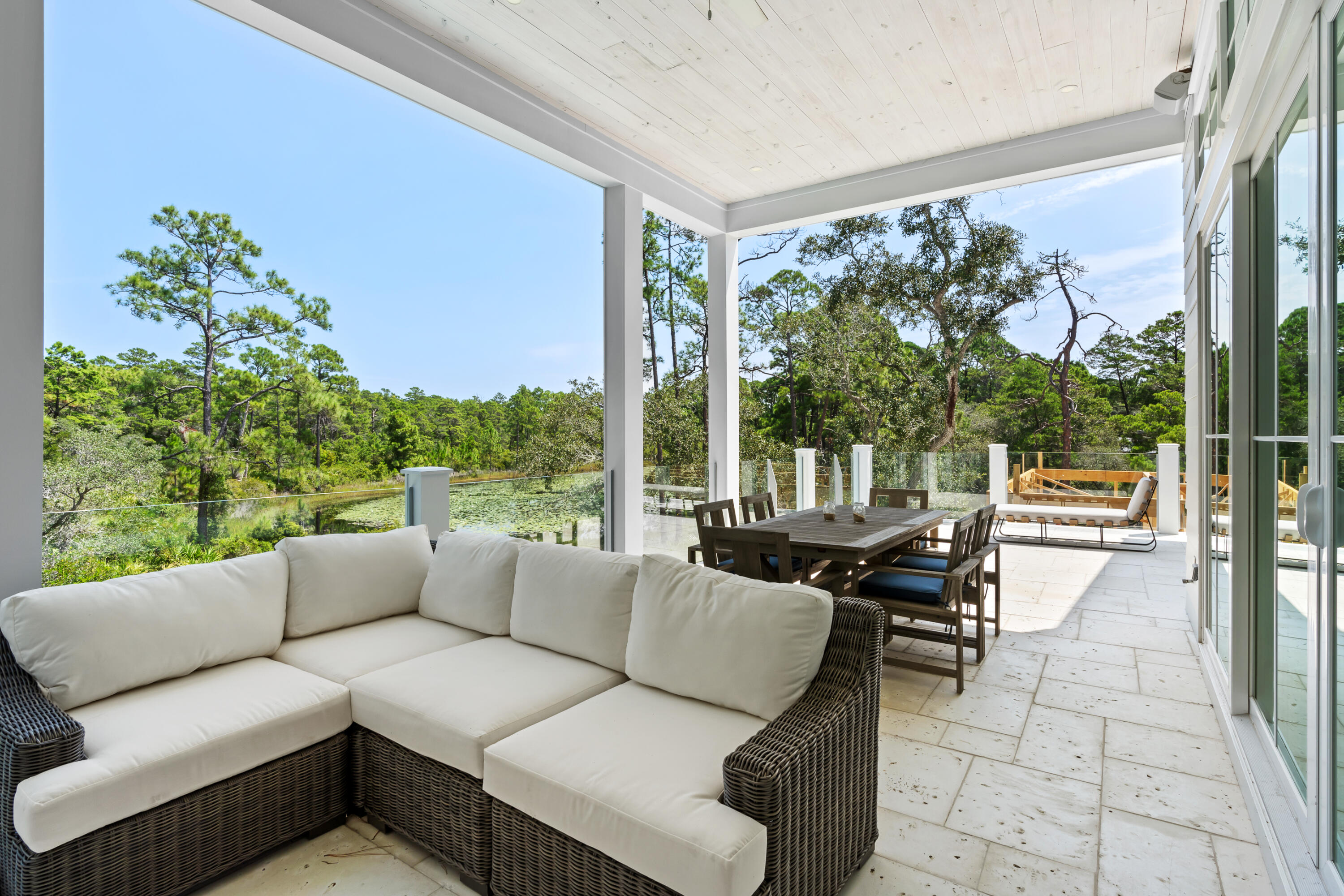 33 Spotted Dolphin Road Santa Rosa Beach, FL 32459 - Photo 21 of 42 a living room with patio furniture and a large window