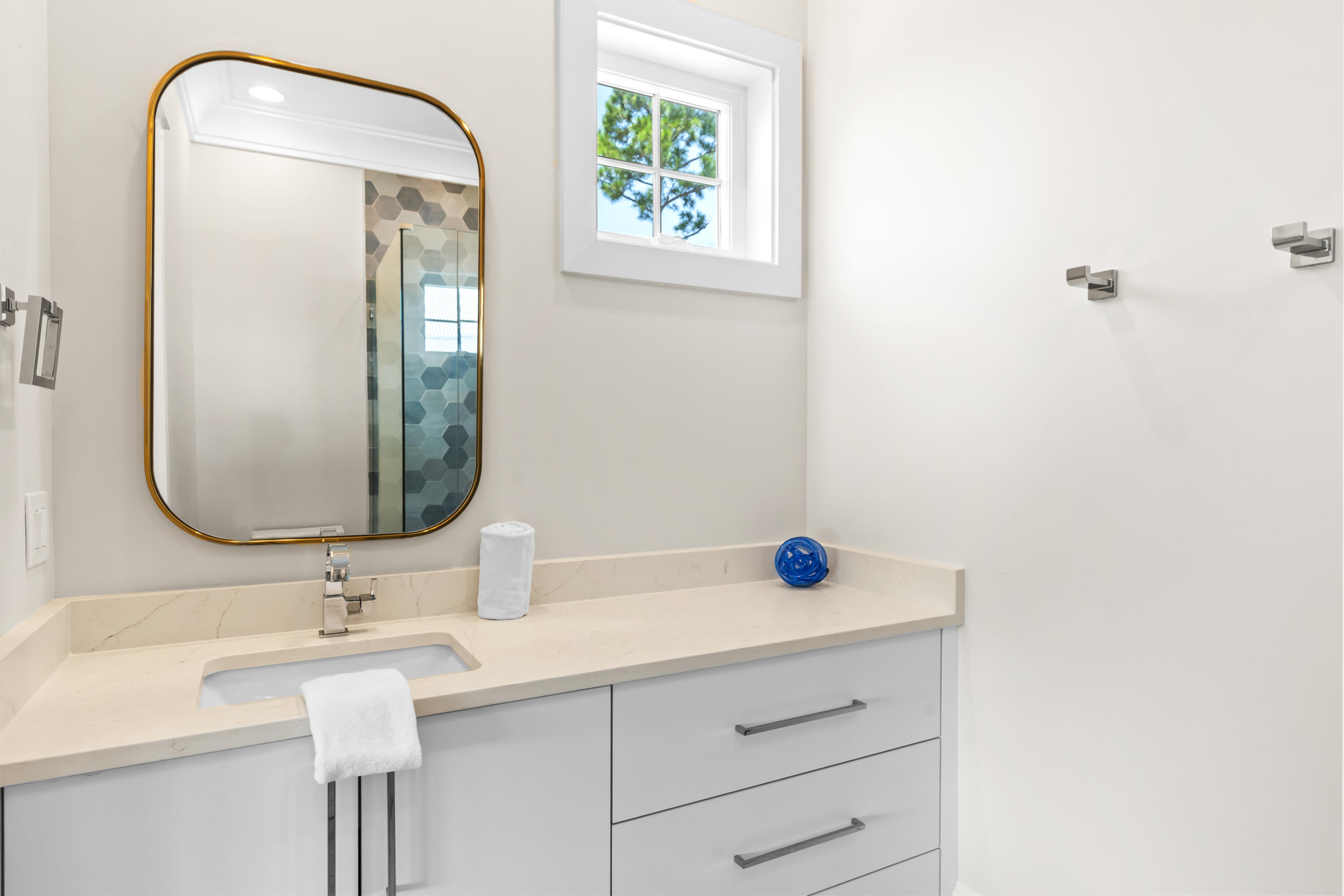 33 Spotted Dolphin Road Santa Rosa Beach, FL 32459 - Photo 30 of 42 a bathroom with a sink and a mirror