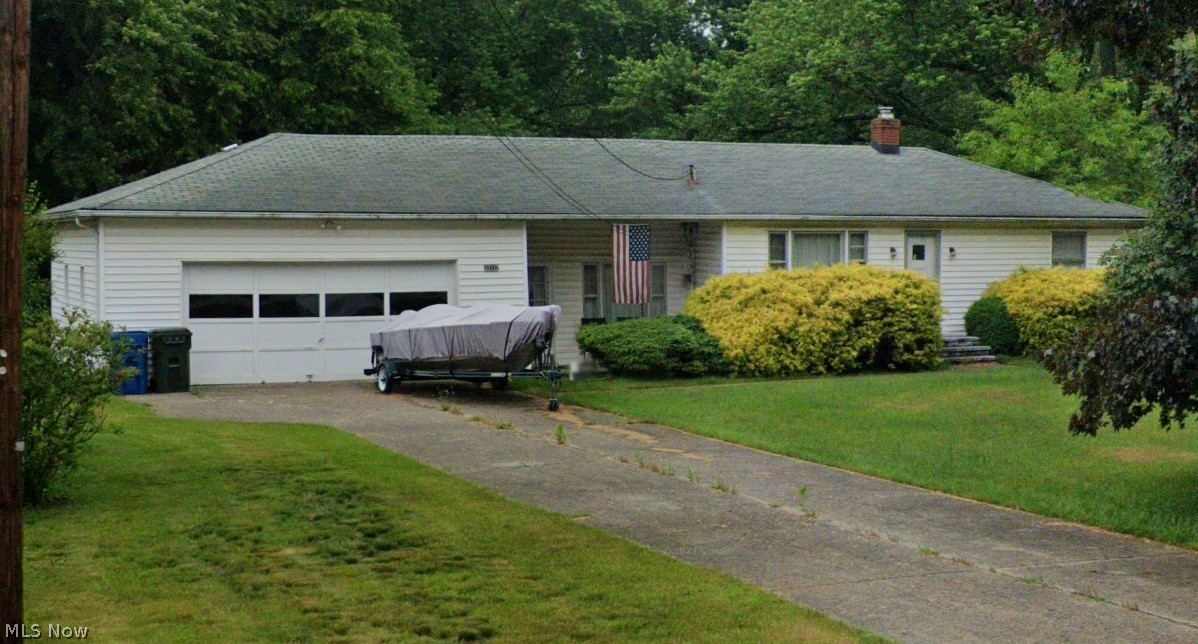33122 Chestnut Ridge Road North Ridgeville, OH 44039 - Photo 1 of 1 Single story home with a front lawn and a garage