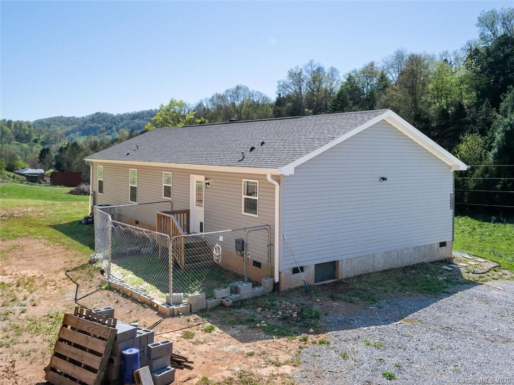 300 Lost Cove Road Clyde, NC 28721 - Photo 9 of 11 a aerial view of a house with backyard