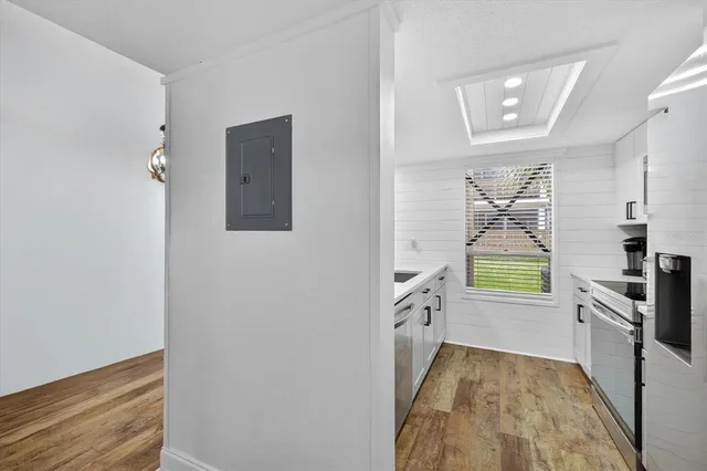 a kitchen with a refrigerator and a stove
