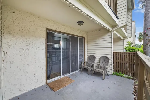a view of a two chairs in the balcony