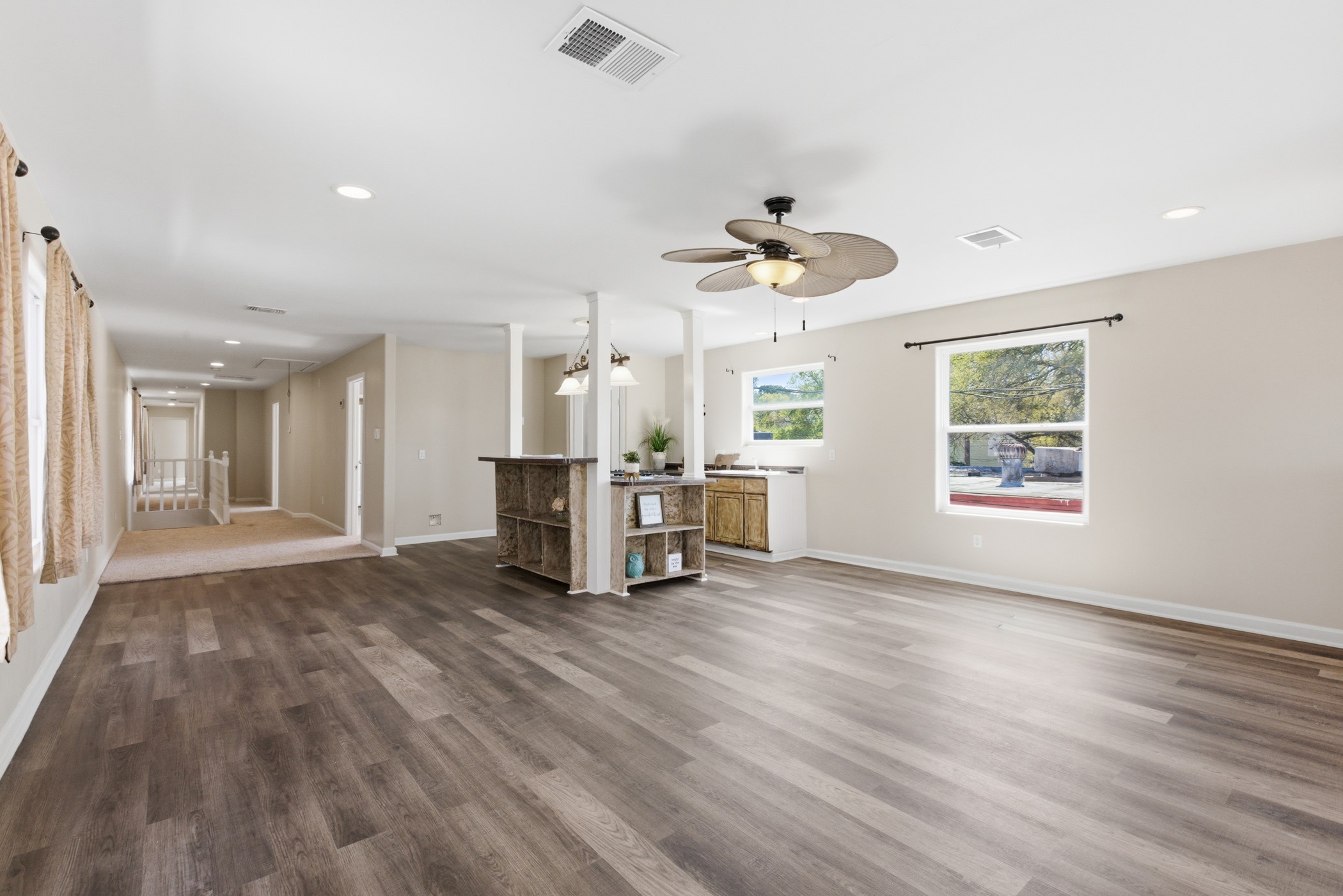 313 Grand Avenue Bacliff, TX 77518 - Photo 23 of 50 a view of an empty room with wooden floor and a window
