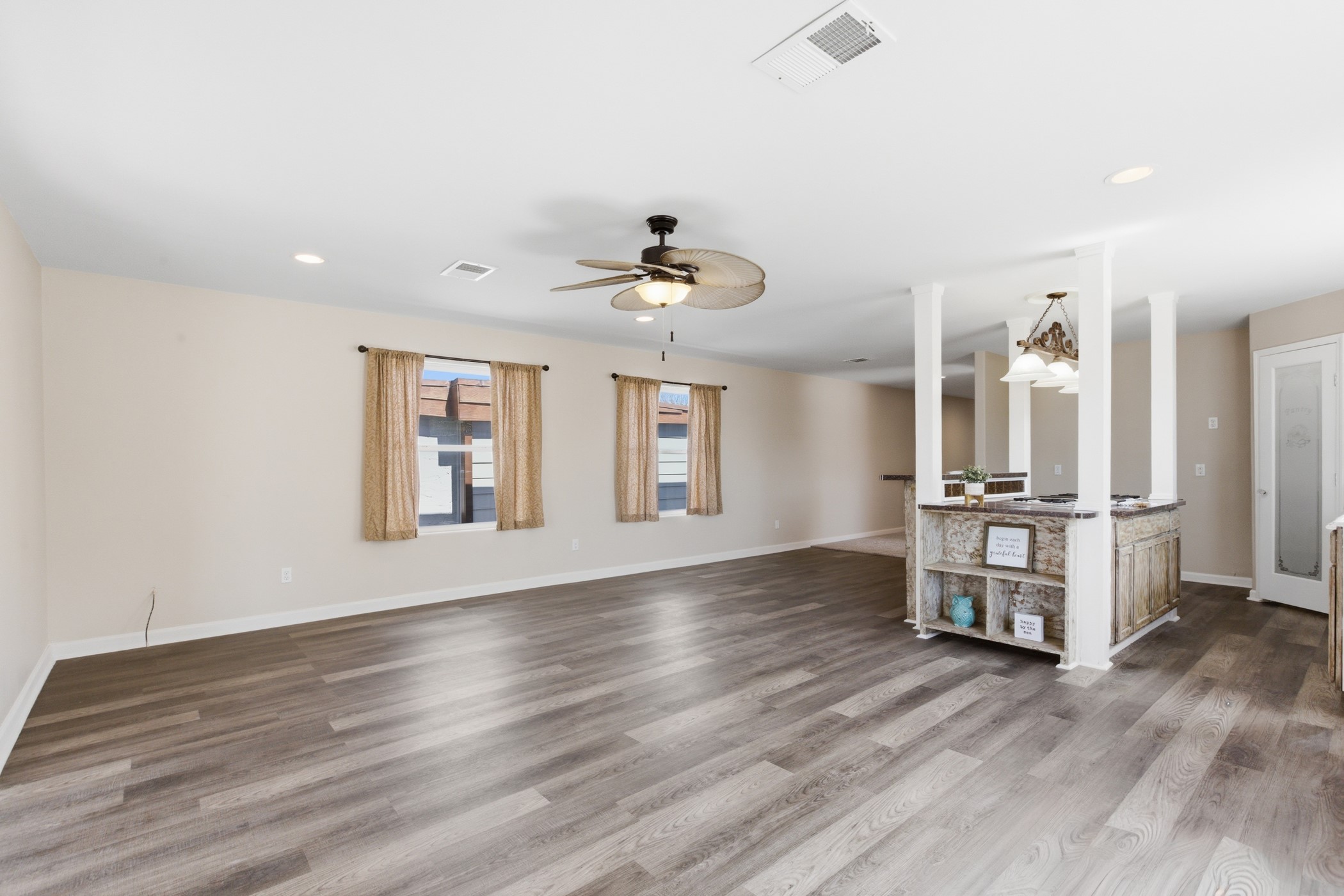 313 Grand Avenue Bacliff, TX 77518 - Photo 26 of 50 a view of an empty room with a window and wooden floor