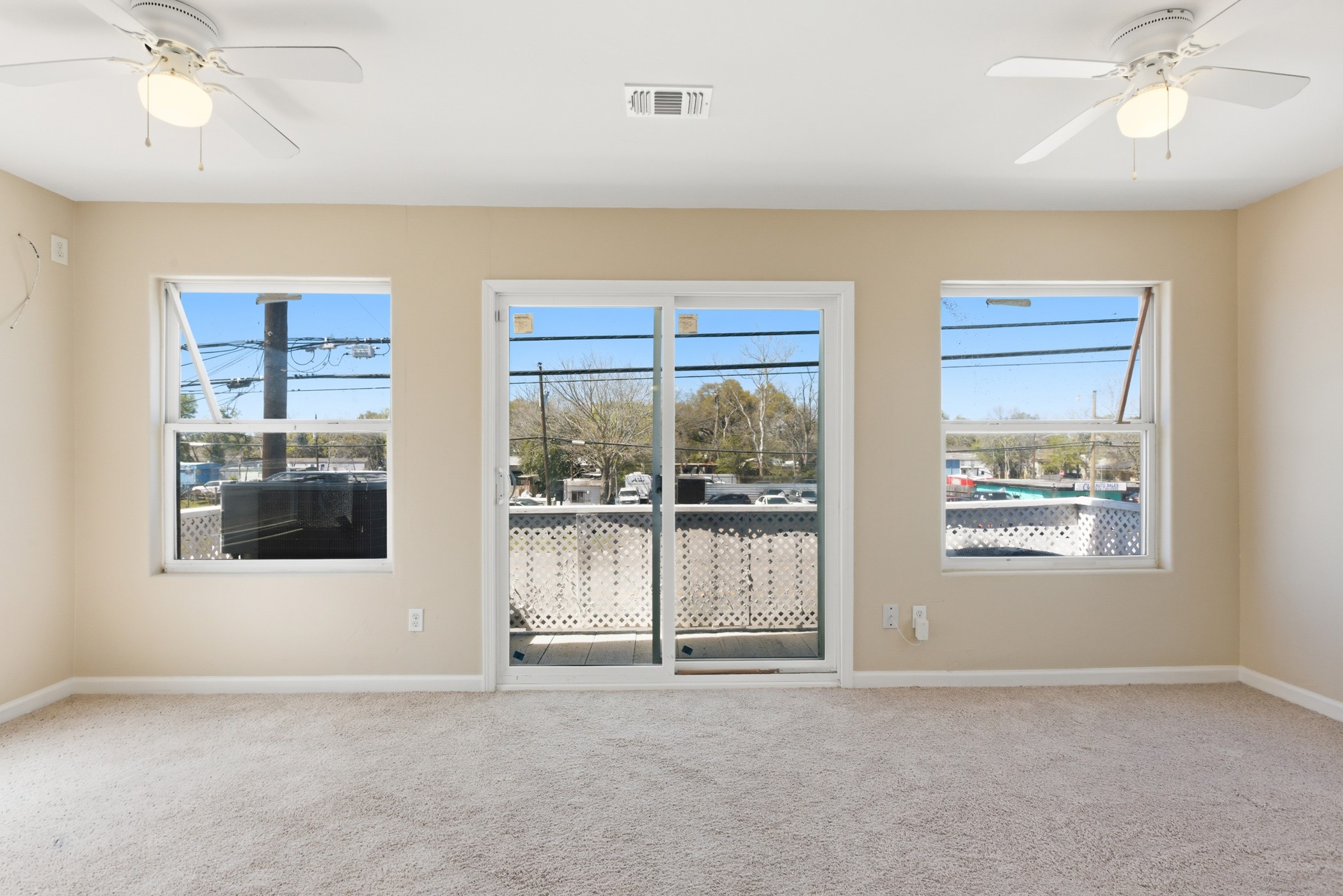 313 Grand Avenue Bacliff, TX 77518 - Photo 31 of 50 an empty room with windows and fan
