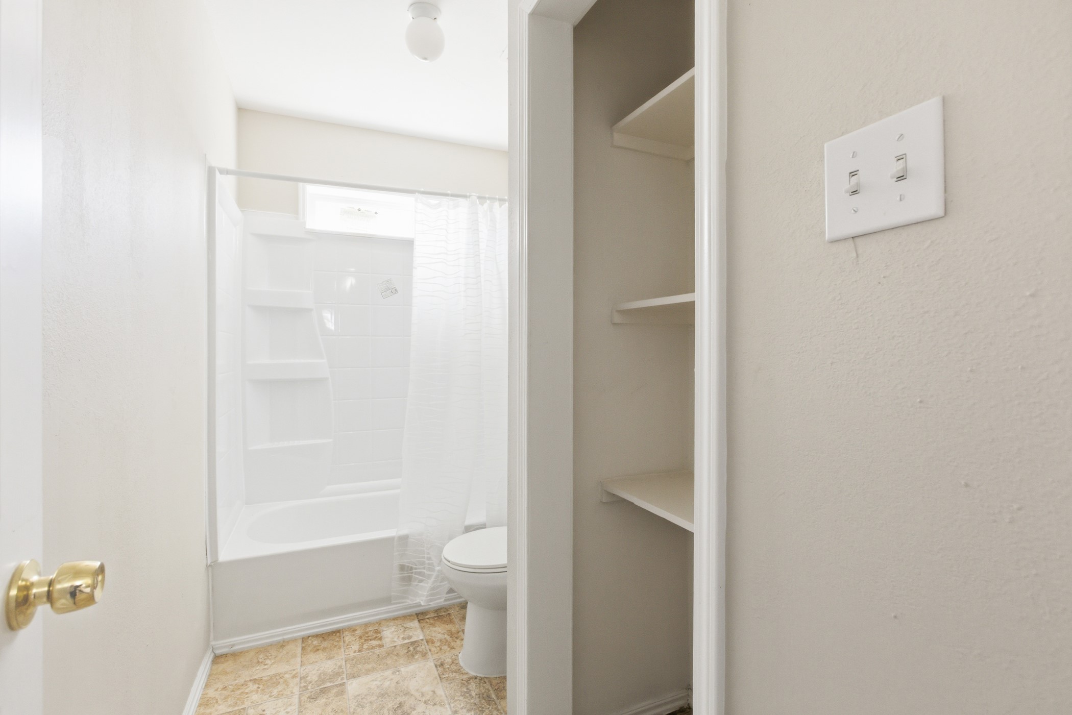 313 Grand Avenue Bacliff, TX 77518 - Photo 40 of 50 a bathroom with a shower and a toilet
