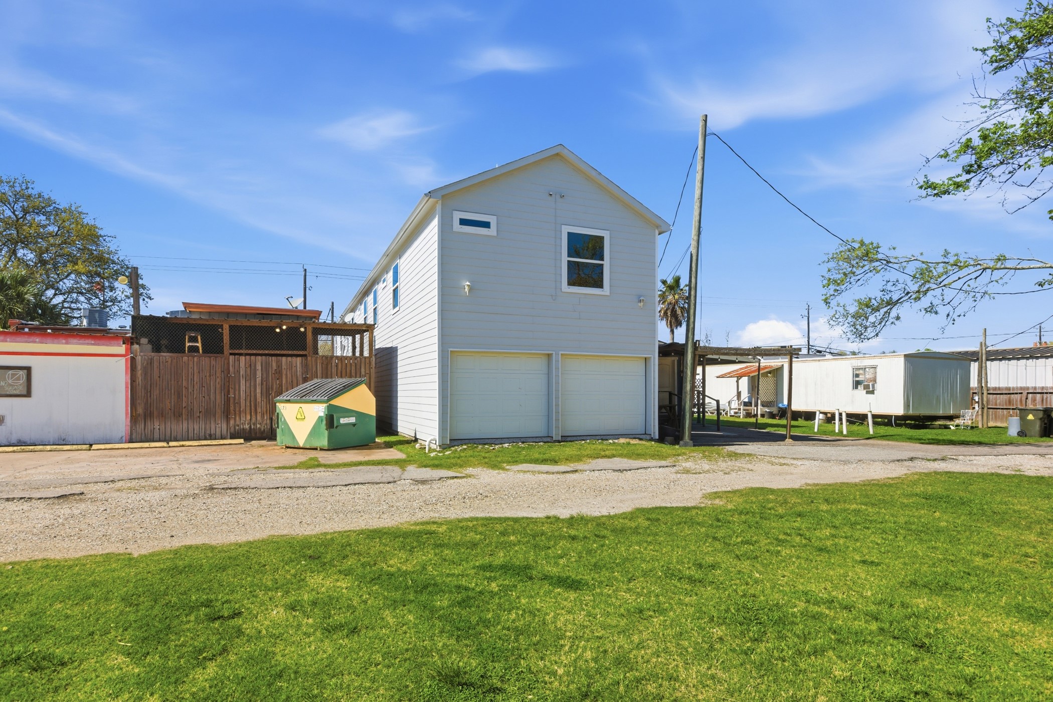 313 Grand Avenue Bacliff, TX 77518 - Photo 45 of 50 a front view of a house with a yard and garage