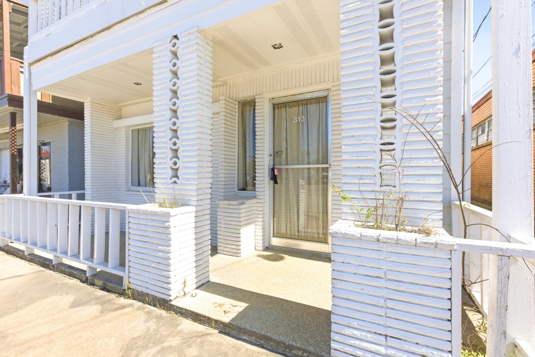 313 Grand Avenue Bacliff, TX 77518 - Photo 6 of 50 a view of a balcony with a chair and the porch