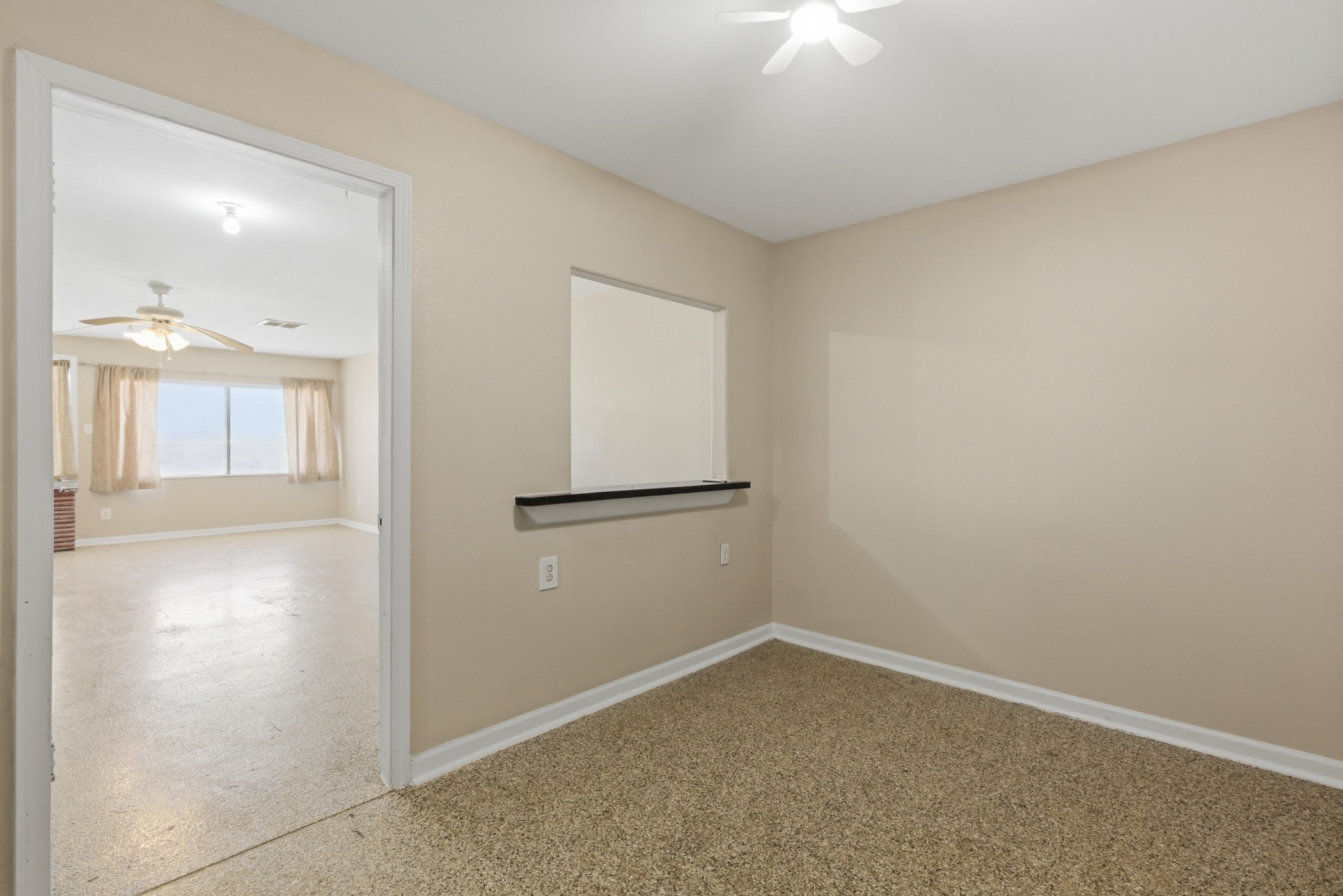 313 Grand Avenue Bacliff, TX 77518 - Photo 10 of 50 an empty room with a windows and ceiling fan
