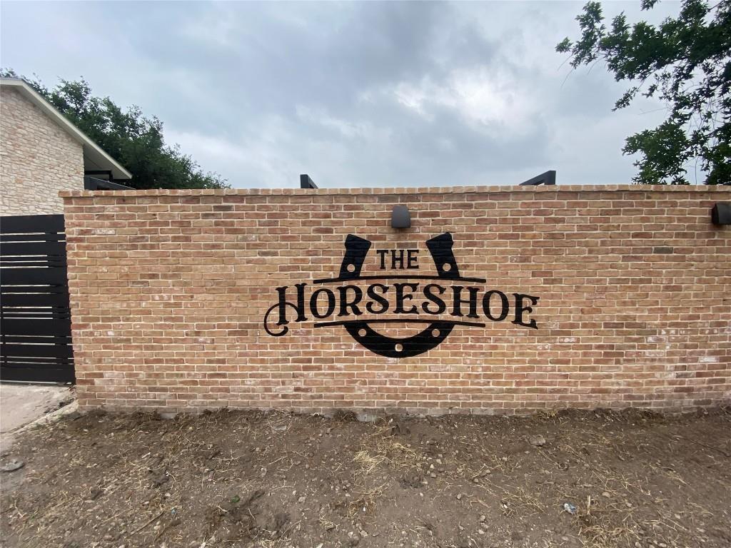 a view of a brick wall next to a building