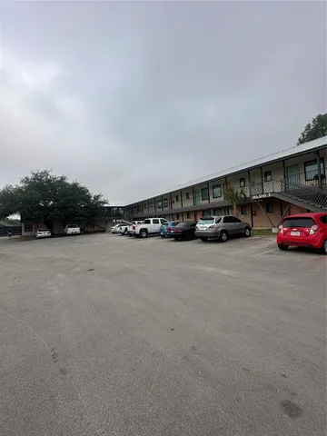 a view of street with parked cars