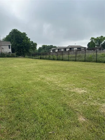 a view of a field with grass
