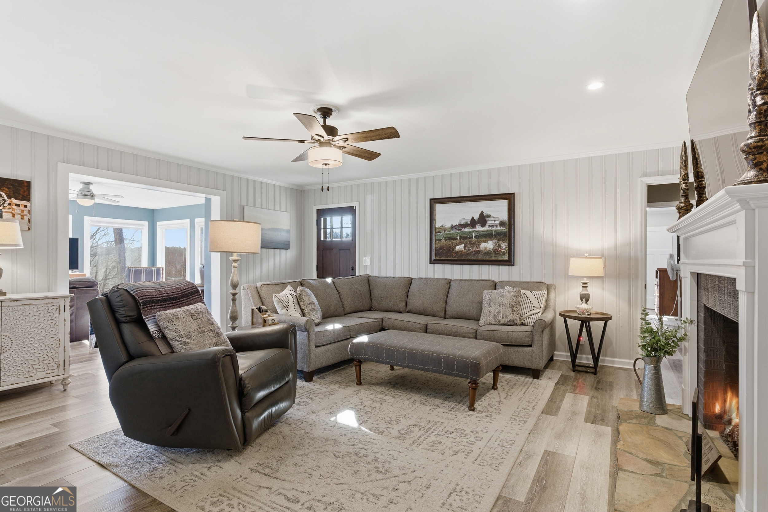 281 Line Road Toccoa, GA 30577 - Photo 21 of 93 a living room with furniture a fireplace and a chandelier