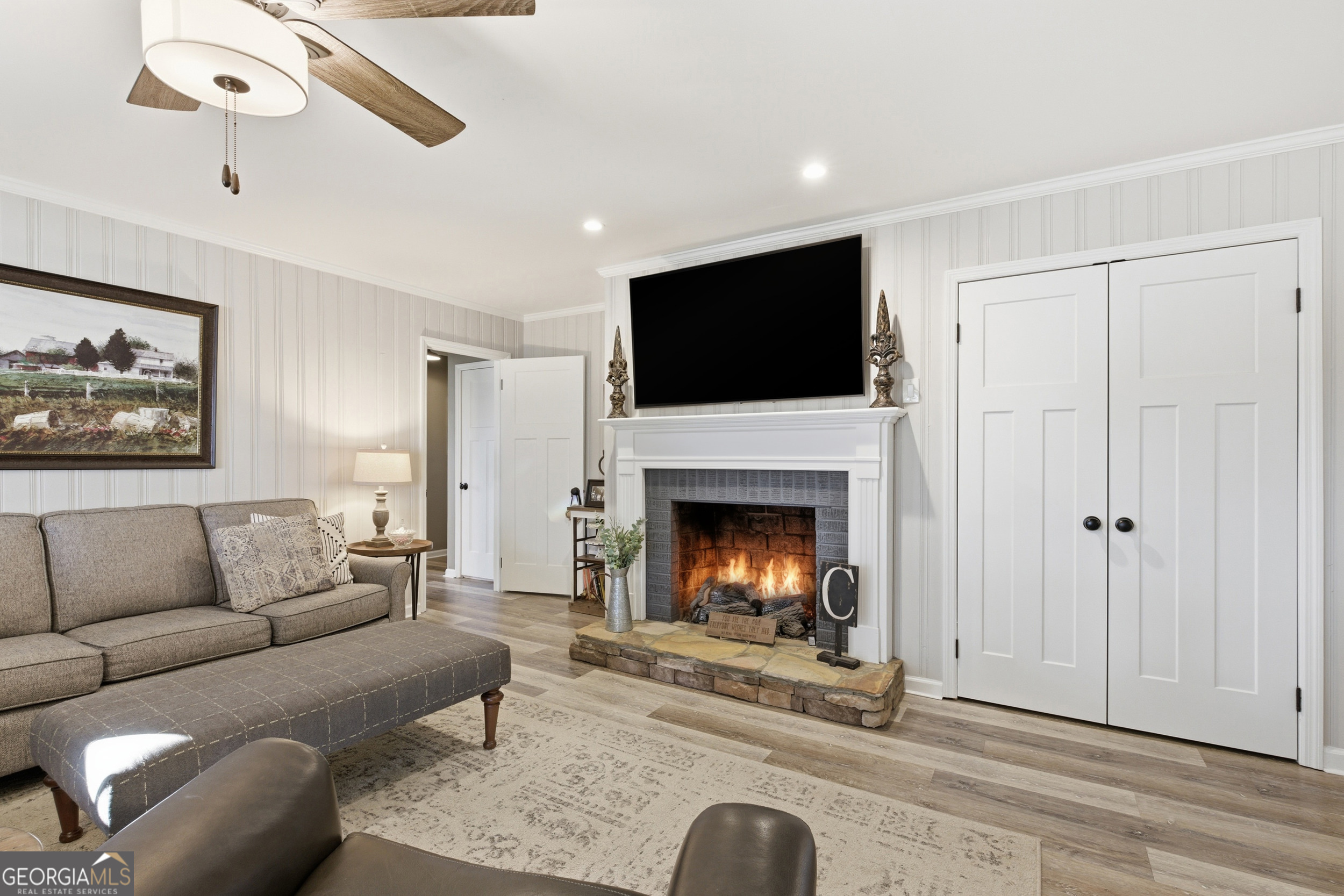 281 Line Road Toccoa, GA 30577 - Photo 24 of 93 a living room with furniture a flat screen tv and a fireplace