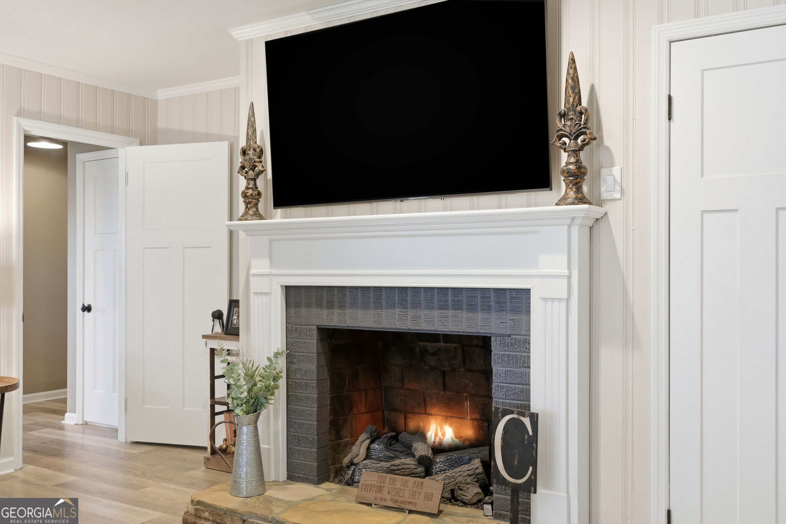 281 Line Road Toccoa, GA 30577 - Photo 25 of 93 a living room with a fireplace and a flat screen tv