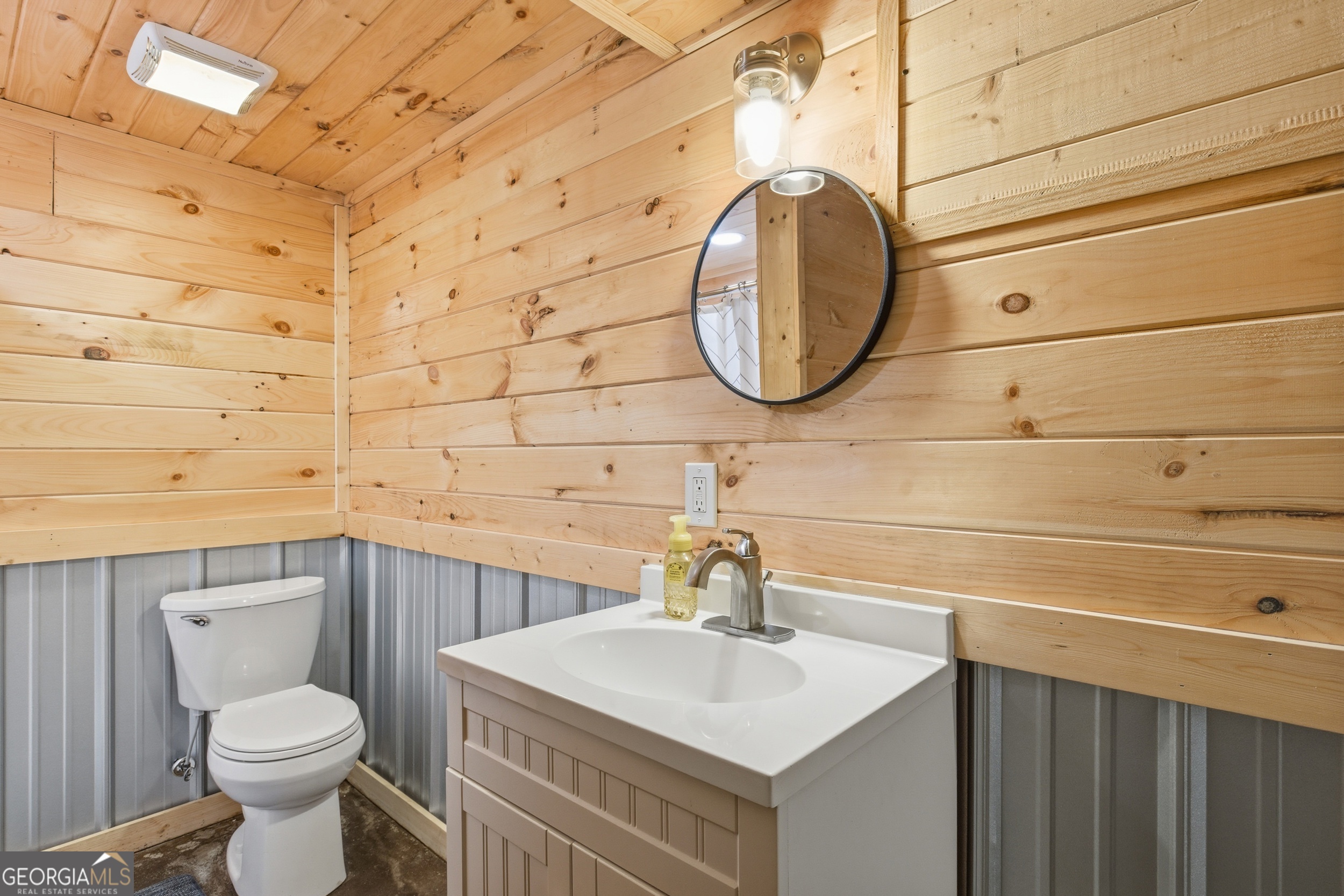 281 Line Road Toccoa, GA 30577 - Photo 49 of 93 a bathroom with a sink a toilet and a mirror