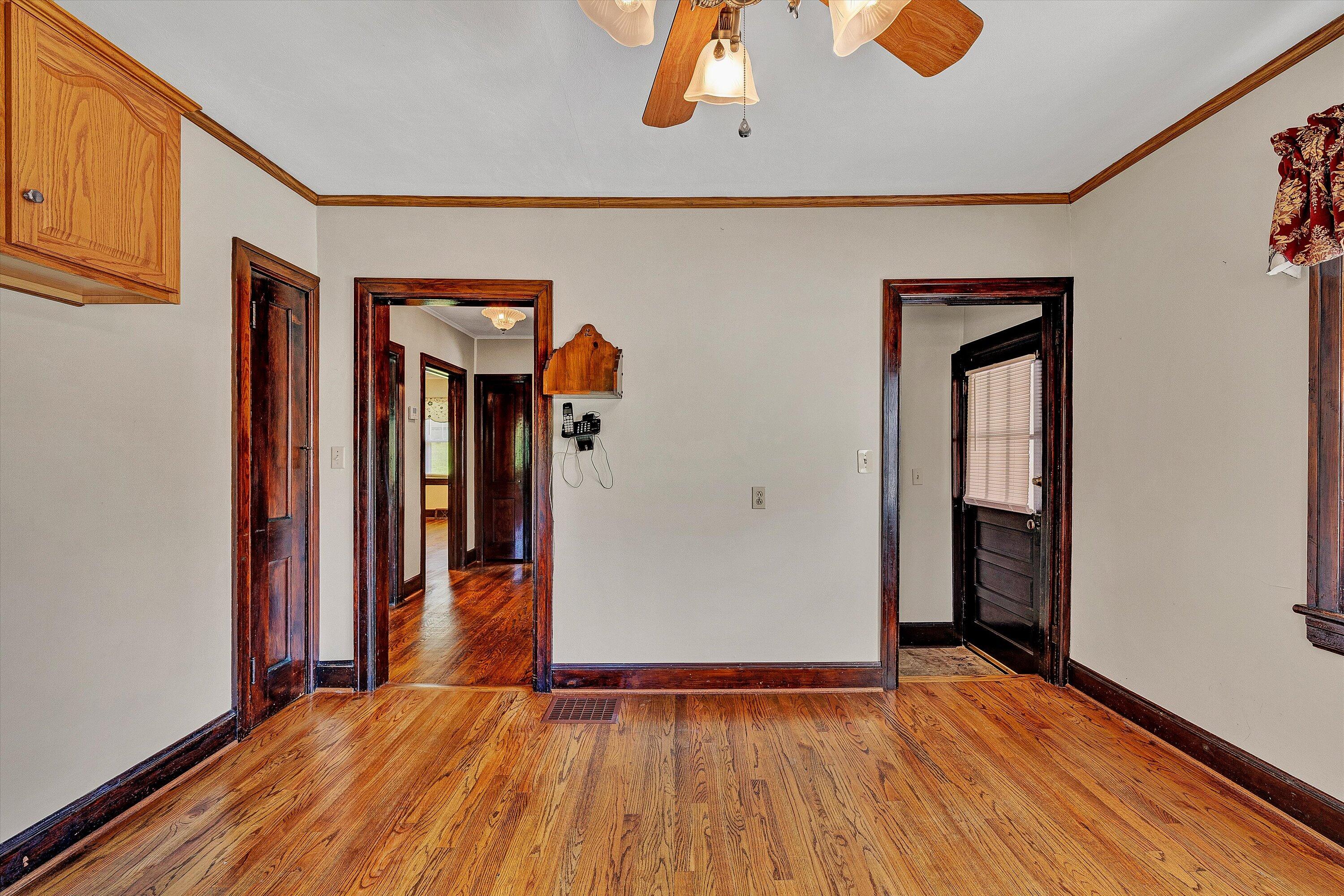 77 Mountain Pass Road Blue Ridge, VA 24064 - Photo 13 of 42 a view of an empty room with wooden floor and a window