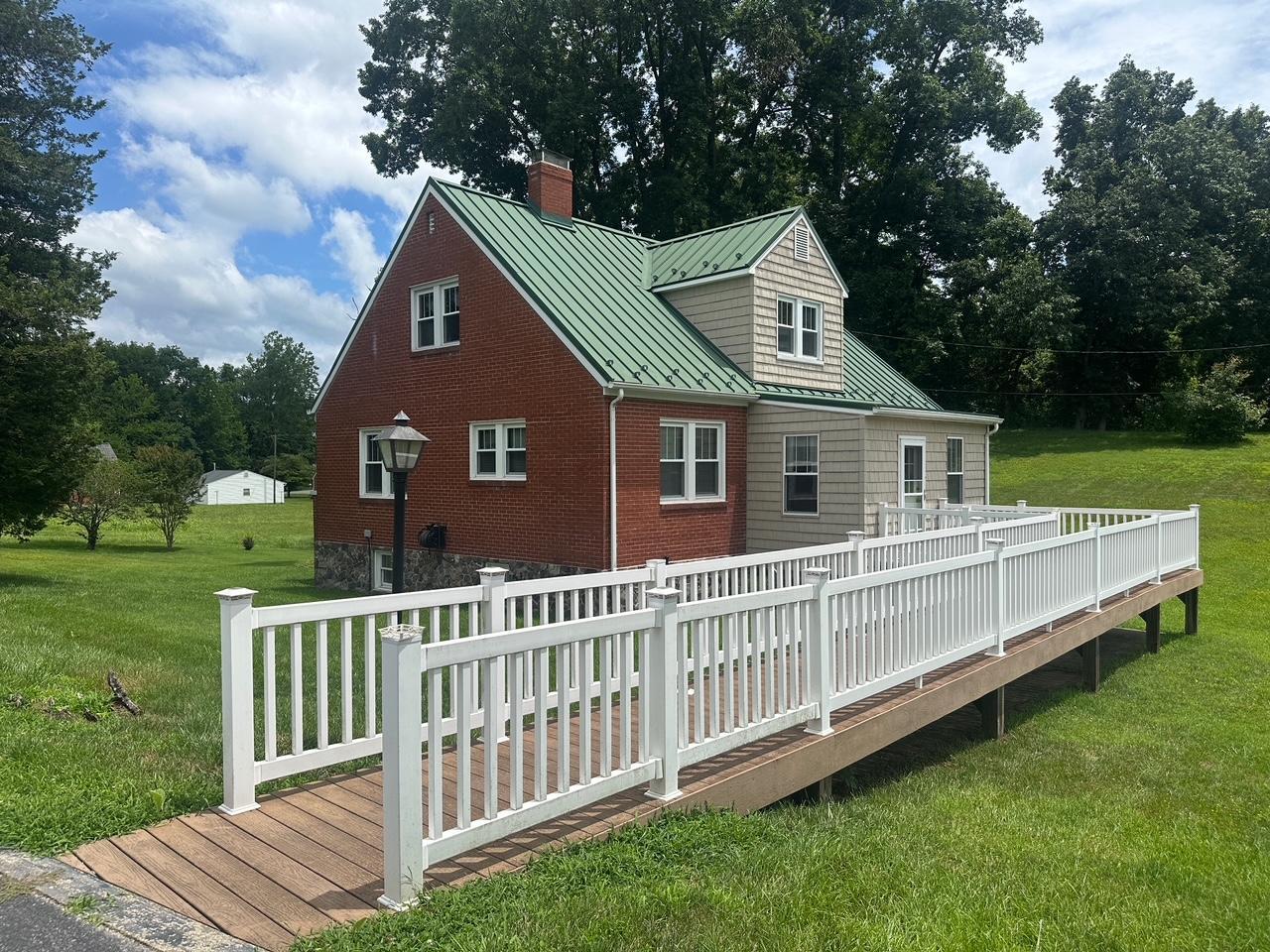 77 Mountain Pass Road Blue Ridge, VA 24064 - Photo 5 of 42 a front view of house with yard and green space