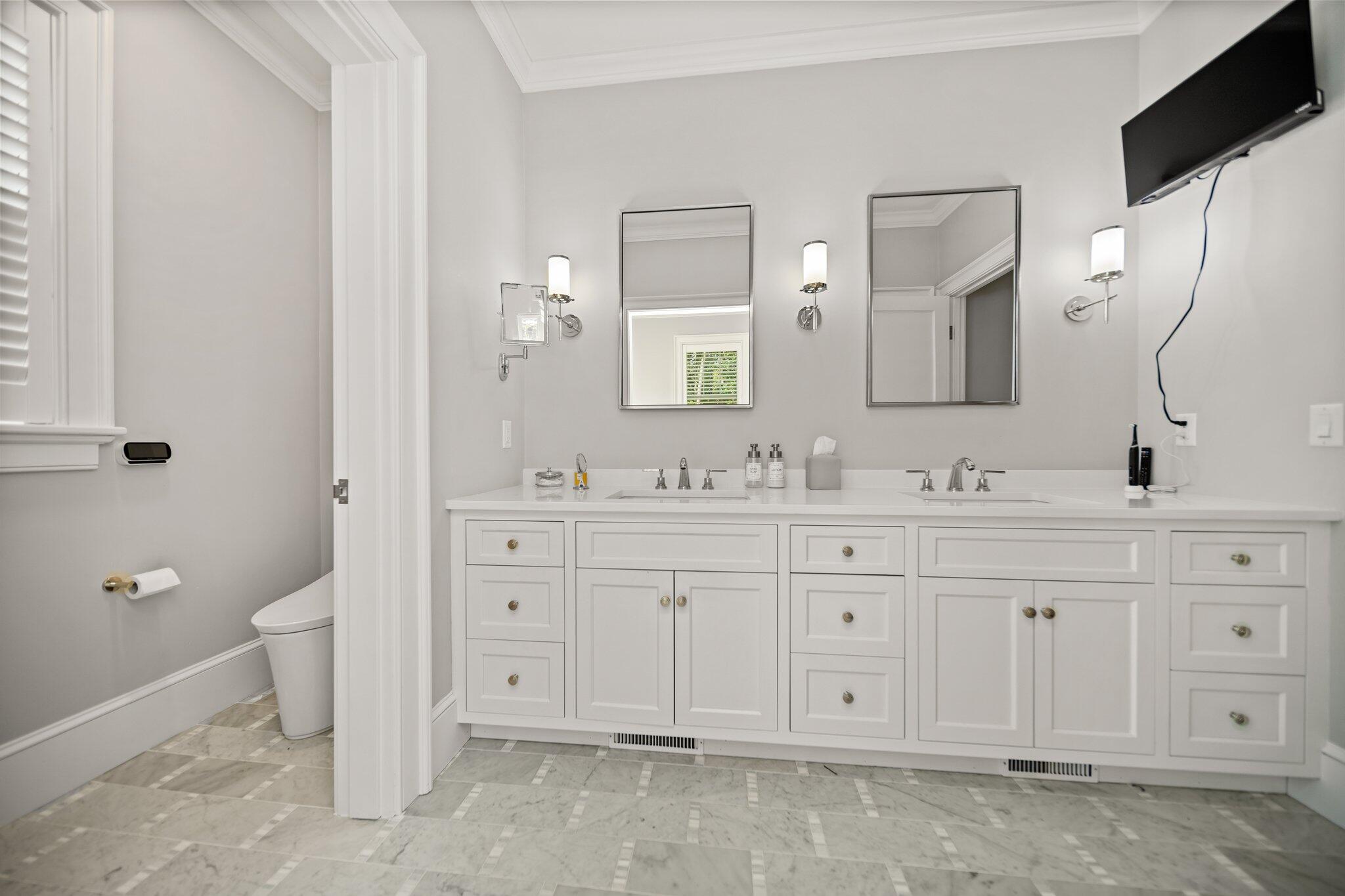 444 Vineyard Road Cotuit, MA 02635 - Photo 16 of 59 a spacious bathroom with double sink and a mirror