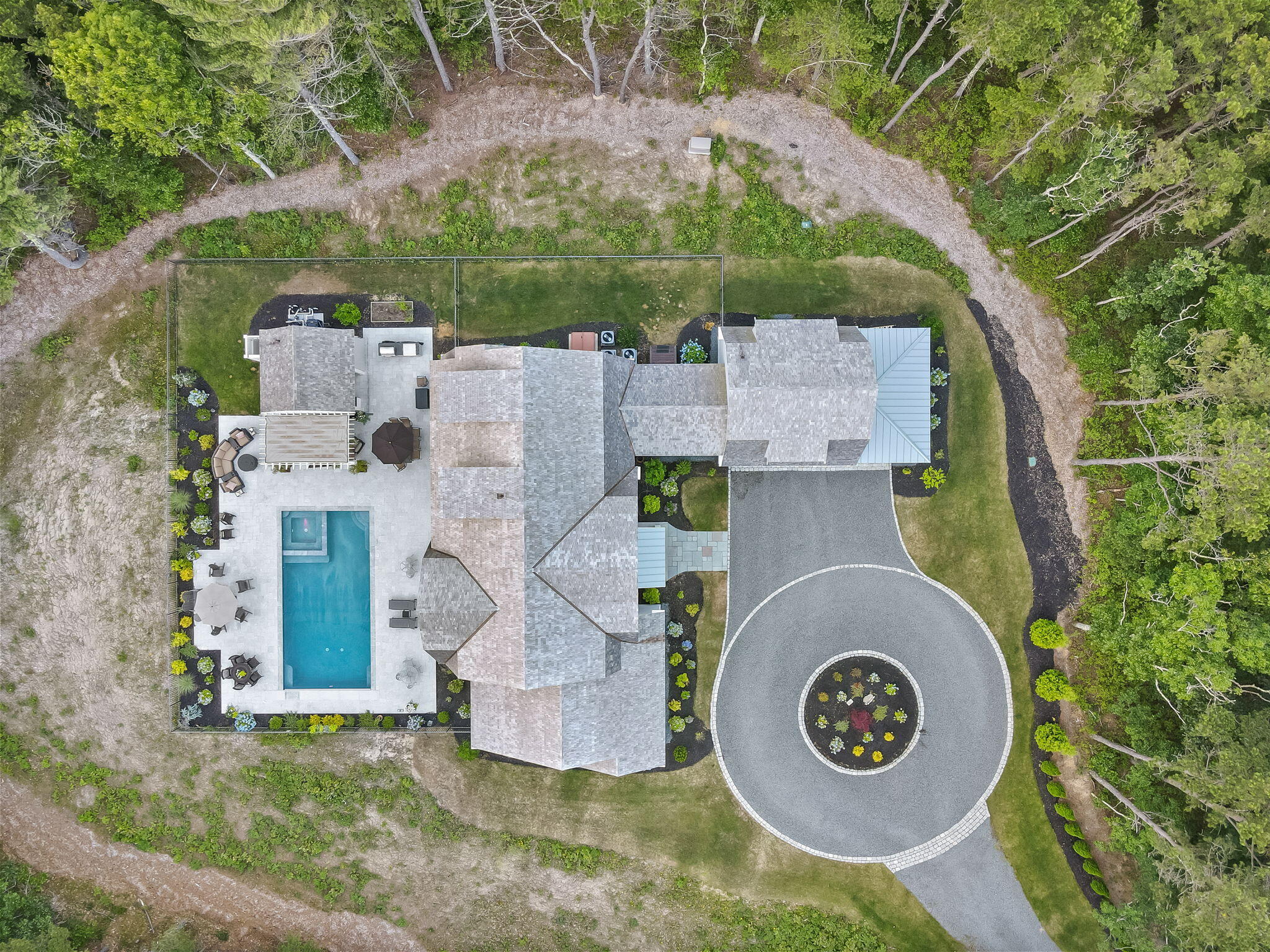 444 Vineyard Road Cotuit, MA 02635 - Photo 3 of 59 an aerial view of a house with garden space and a car park in front of it